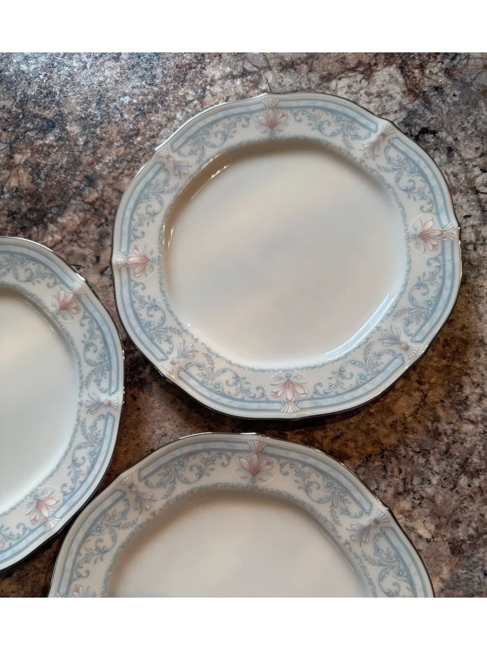 Noritake Crown Flower Dinnerware with Pale Blue and Soft Pink Floral Border